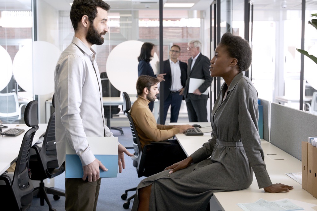 people talking in an office speaking about diversity